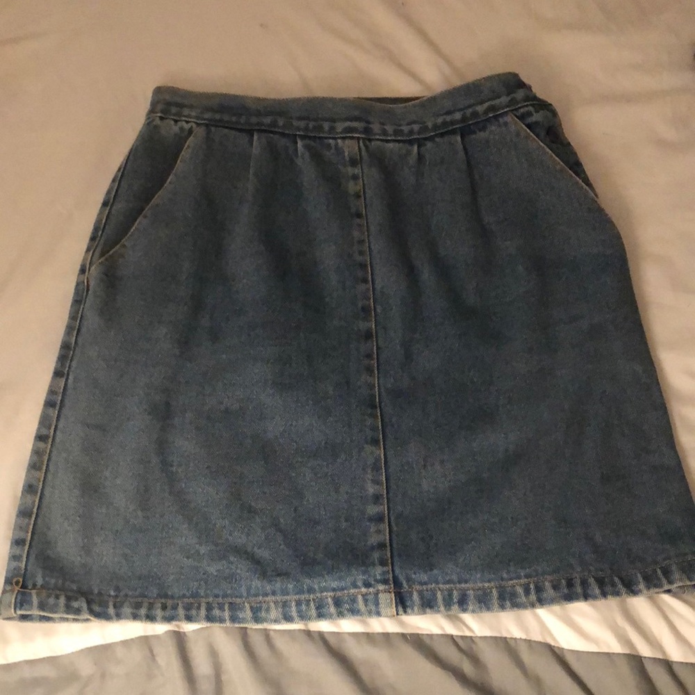 Short denim shirt with button up side, has pockets, nice condition, comfortable.